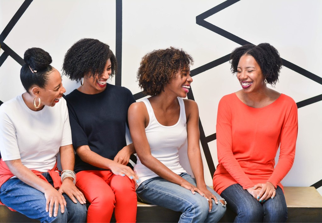 Women with natural hair chatting.   