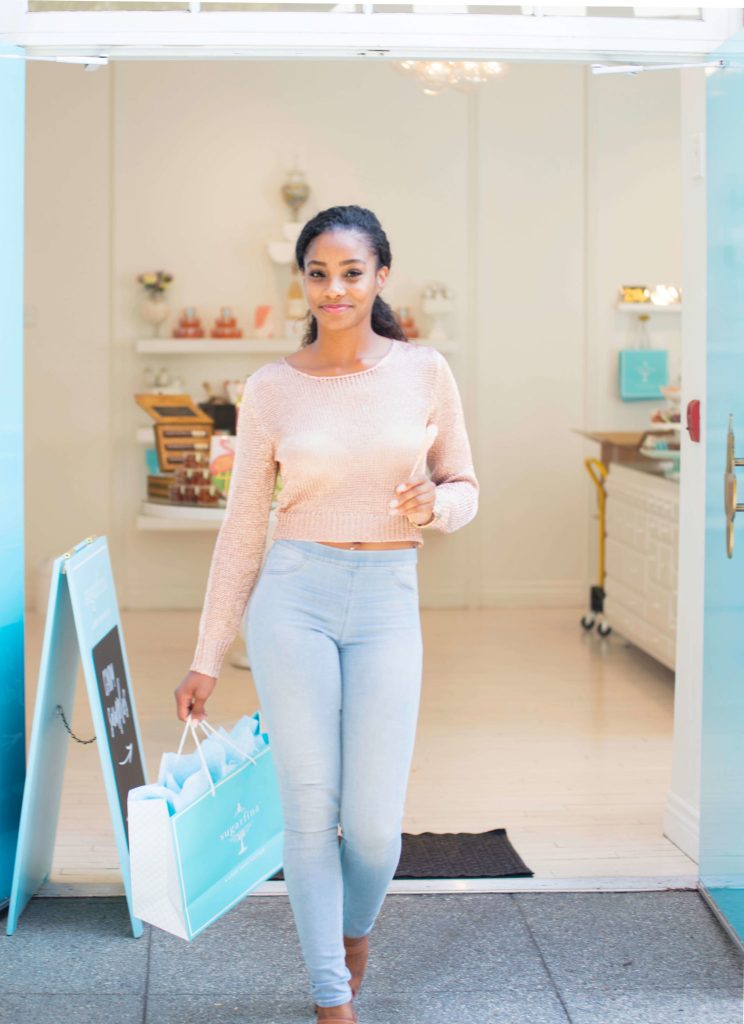 Black woman shopping at a popup shop.